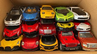 Box full of model Cars, Lamborghini, Bugatti, Laferrari, Mazda, Crosshairs, Rolls royce, Jeep.