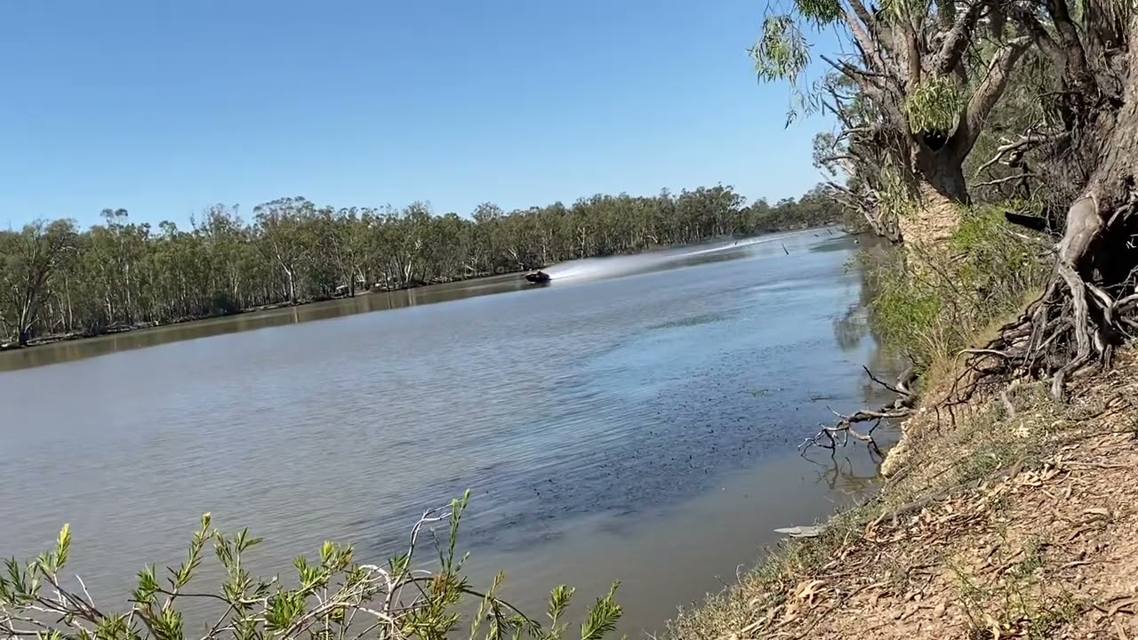 Superman pulling two skiers at 120 mph down the Murray river