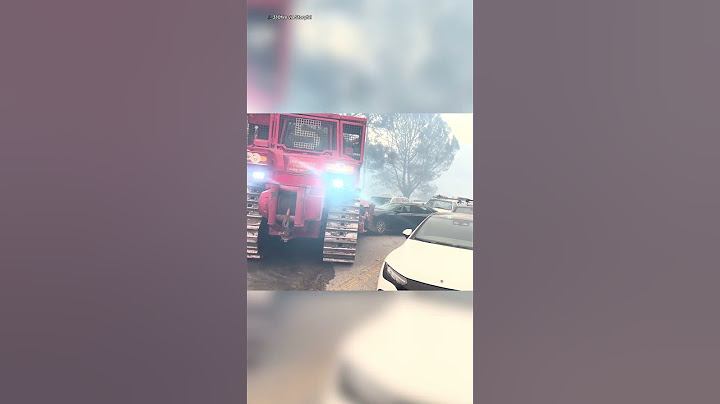 Bulldozer shoves abandoned LA cars