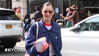 Bella Hadid hands out Kin Euphorics drinks to photographers outside  Gotham gym in the West Village