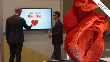 Interactive digital kiosk for a trade show with video mapping and touch screens