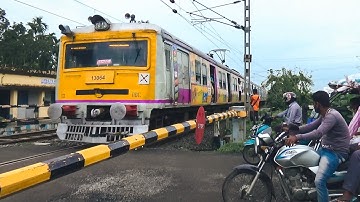 Very colorful high speed EMU local trains furiously passing level crossing 🚦