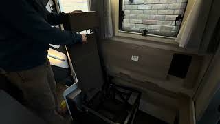 Rear travel seat fold away
