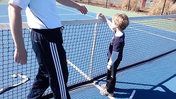 How to set height and tension of a tennis net for both singles and doubles play