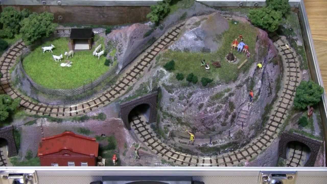 H0e Model railroad in a suitcase - YouTube