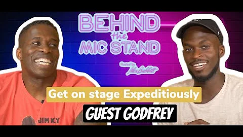 Comedian Godfrey - Behind the mic stand host Alex ...