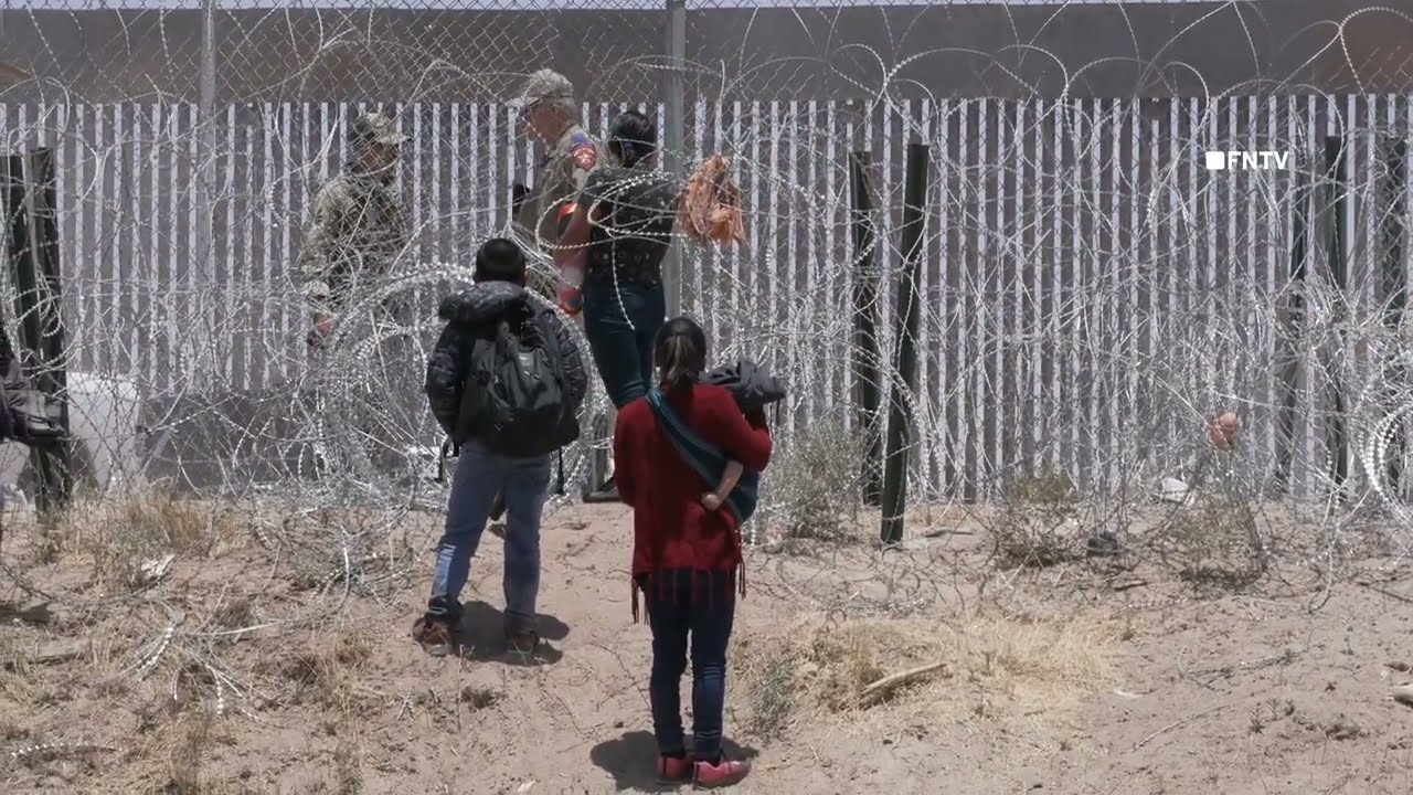 Migrant Family stopped from Hopping Border Wall on Texas - Mexico border