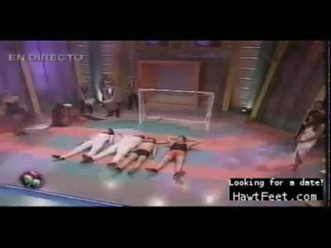 Spanish female trampling men on TV