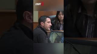 Witness Christopher Davis becomes emotional as a picture of an unconscious Michael Cochran is shown