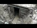 EXCAVATION OF A GERMAN DUGOUT WITH WEAPONS AND AMMUNITION