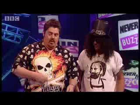 Mark Lamarr is forced to sit cross-legged on his desk to get a full view of the rock icon that is Slash singing and miming the guitar riffs to classic song intro's. Great clip from the hit comedy music quiz show presented by Mark Lamarr, Never Mind the Buzzcocks - BBC.