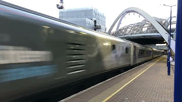 The Chiltern Railways Express, 82302 + 68001 passes through Wembley Stadium station.