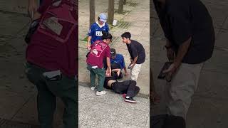 Skateboarder 50-50 grinds handrail then falls forward and lands in scorpion position
