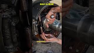 An expert mechanic installs truck brake springs using a screwdriver as leverage.#shorts #mechanic