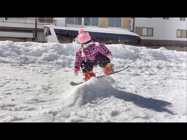 1 year old girl's first time snowboarding and jumping