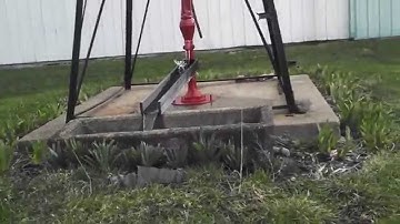 1910 Baker Windmill Pumping Water.