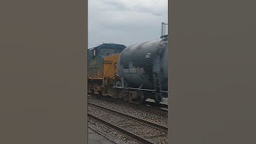 fresh rebuilt SD70. FLARED Mac leads CSX manifest
