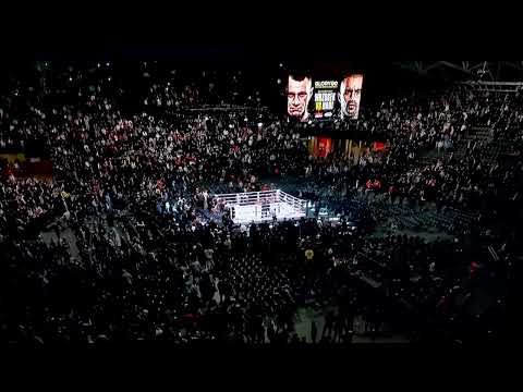 Badr Hari vs. Arkadiusz Wrozosek fans audience fight throwing chairs abandoned cancalled glory 80