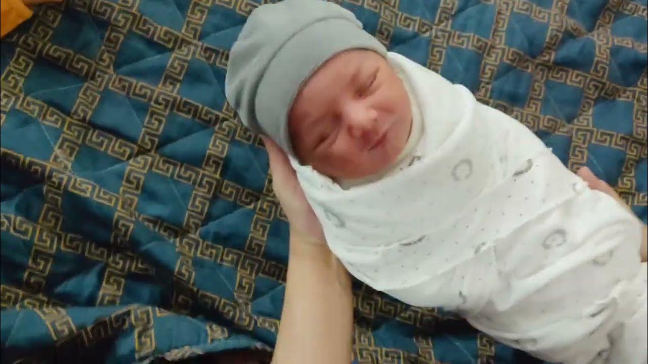 Swaddling of Crying newborn baby in easiest way to make her calm down 