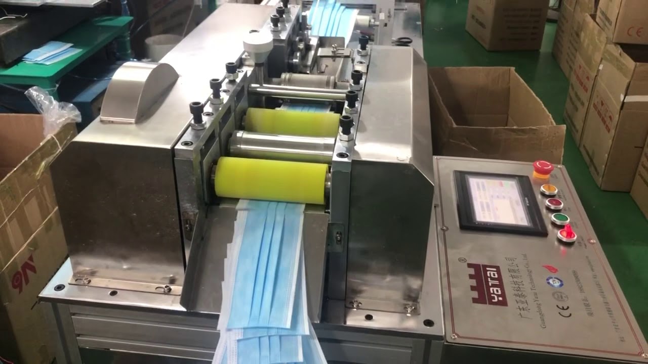 Face mask stacking machine