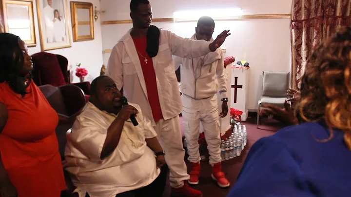 Apostle Dr. Craig Booker laying hands
