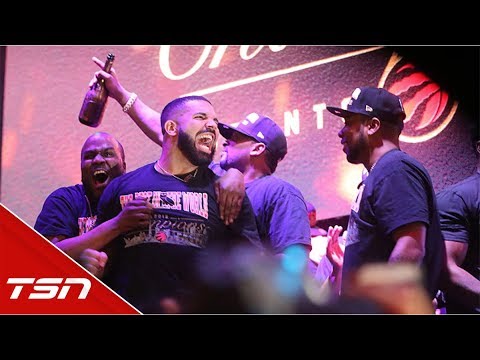 Drake celebrates with fans in Jurassic Park after Raptors win title