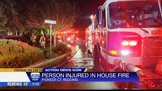 Person transported to hospital with burn injuries after house fire Tuesday night in Redding