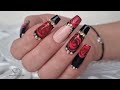 Valentine's Day Nails. Red and black nails with blooming gel rose.