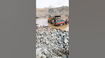 Bobcat Loading big rocks into Trailer #stonecrusher #shorts #viralvideo#automobile#bobcat