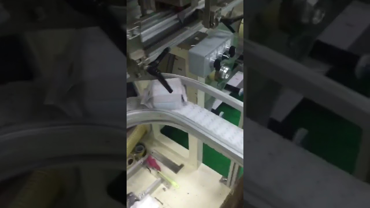 Full automatic sanitary pad packaging machine. dnwmachinery.com 