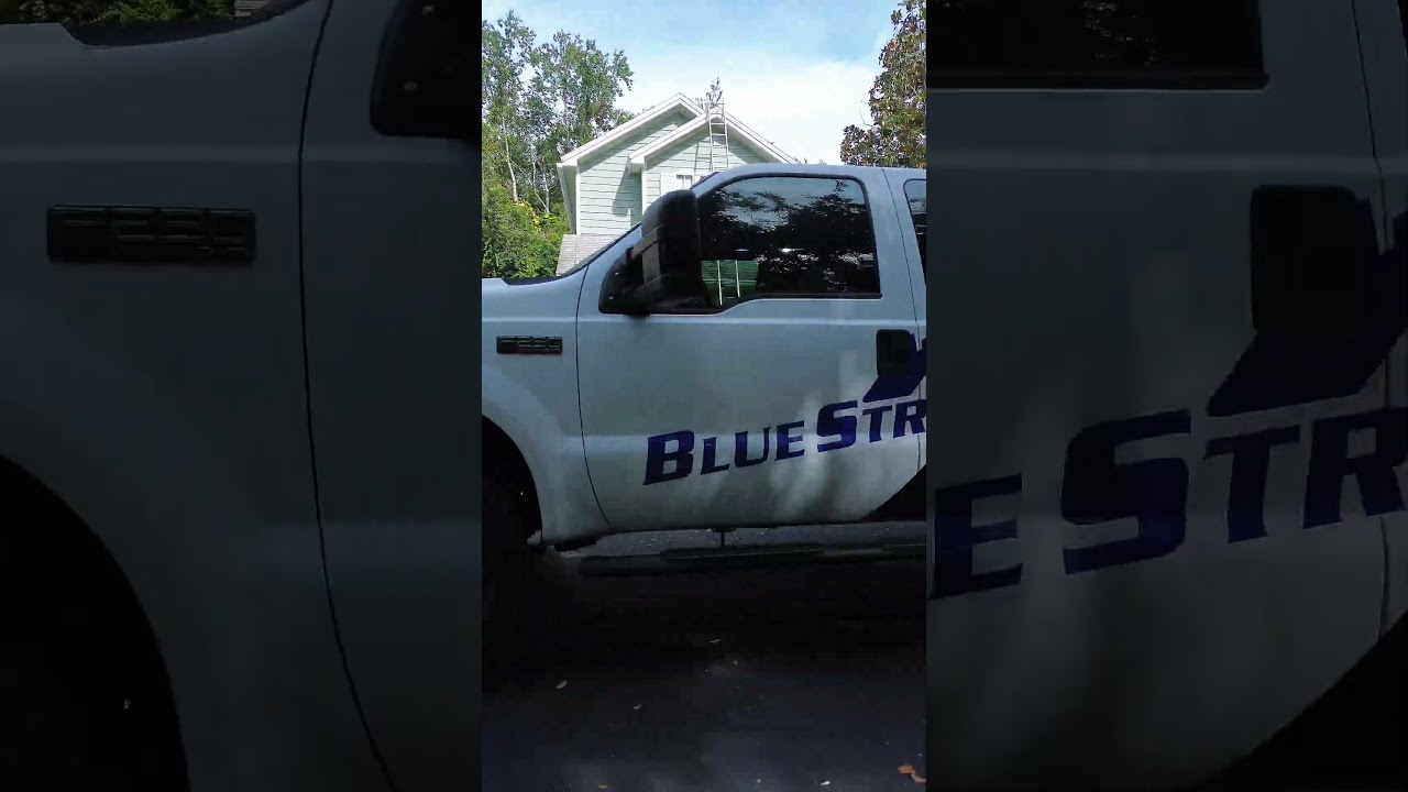 Blue Stream Roof Cleaning & Pressure Washing soft washing a Florida roof