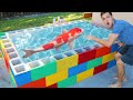 Building A GIANT LEGO Pond For My Colorful Fish Army!!