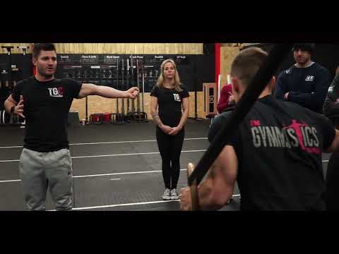 Straight leg lift standing over a box (or object): Gymnastics Programming