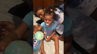 Toy Popped as a Mother Was Holding It Causing the Liquid to Spill on Bed