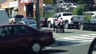 Young Jewish Hasidic Teen Assisting An Elderly Chinese Woman in Brooklyn NY