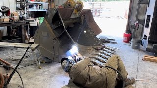 Wings on an excavator bucket!!!  But will it Fly?