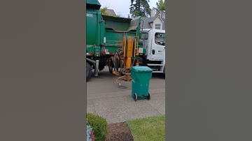 WM Labrie Automizer Right-Hand setting down a yard waste bin