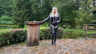 Granate Styling, walking outdoor in late summer, leather shorts, crotch high boots, high heels