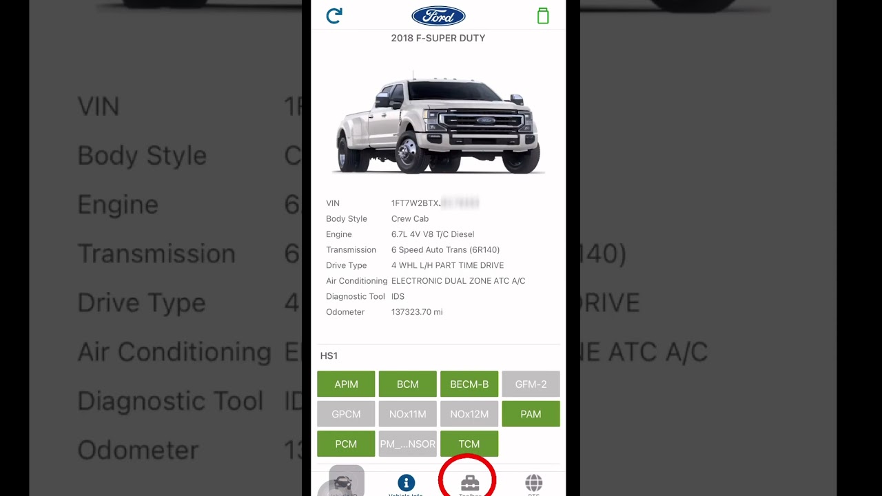 Ford dealership technician accessing vehicle VIN database for keyless entry code
