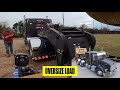 Heavy haul trucker, kenworth moving oversize excavator with RGN lowboy