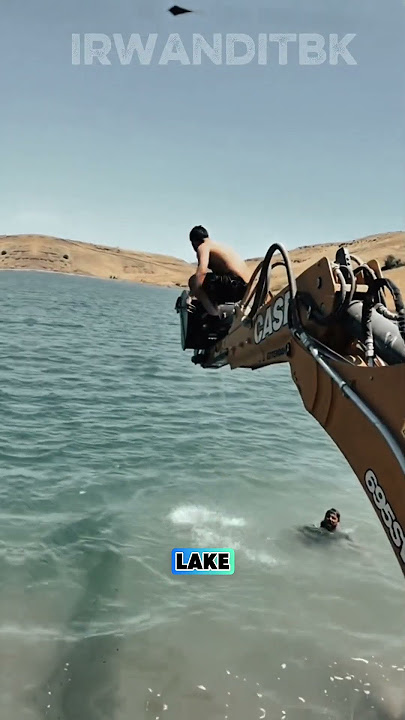 Wow‼️Man Jumps from Excavator Bucket into Lake #excavator #viral #shorts