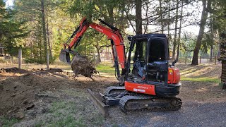 Stumps and pad with the Kubota KX 040 4 excavator