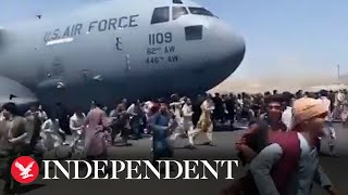 Afghans climb onto moving plane in attempt to flee Taliban