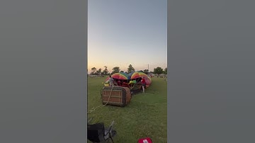 Blowing up hot air balloons at local festival