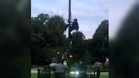 Woman removes confederate flag in SC