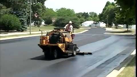 SealMaster Sealcoating Liquid Road Asphalt Pavement Sealer on Parking Lot