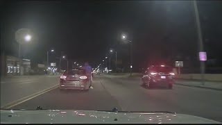 Gunman who hung out of car shooting at Detroit police, arrested tonight