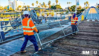 Download Lagu 𝗧𝗘𝗠𝗣𝗢𝗥𝗔𝗥𝗬 𝗕𝗔𝗥𝗥𝗜𝗘𝗥𝗦: Crews Install Fencing on Santa Monica Pier Ahead of Bridge Replacement MP3