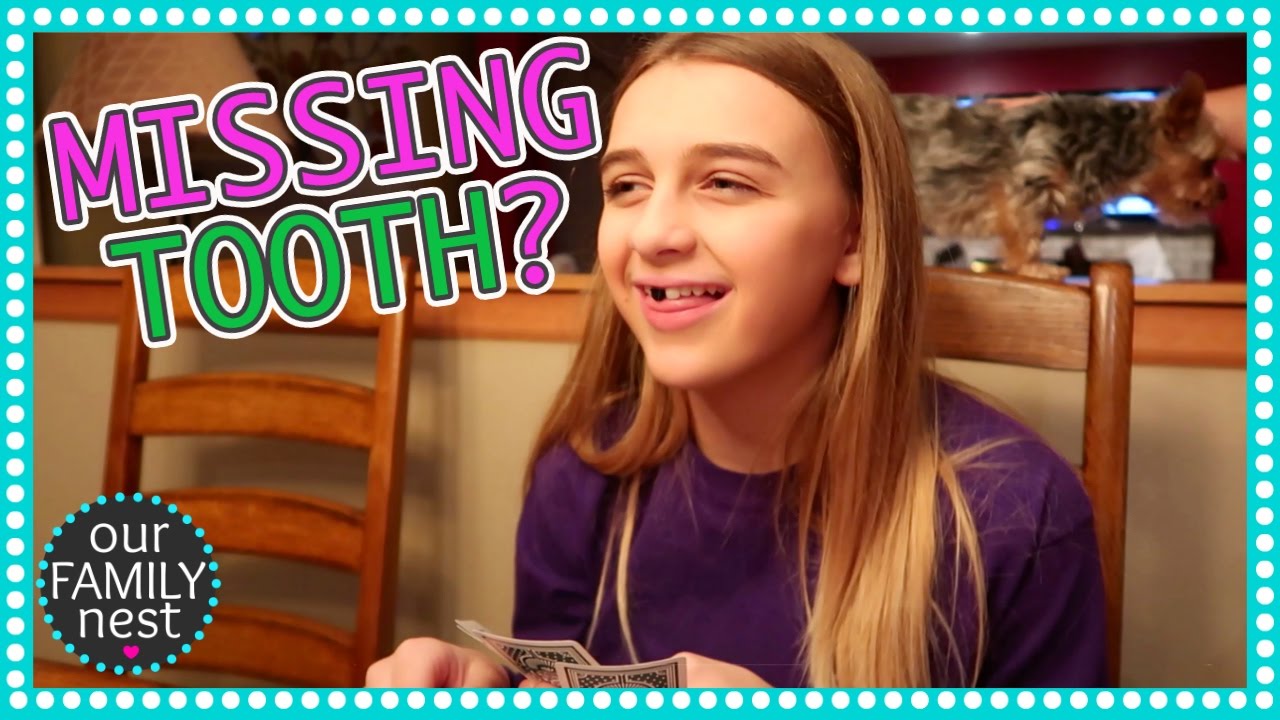 WHAT HAPPENED TO HER TOOTH?
