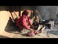 Nepali village  cooking pork meat and vegetables in the village